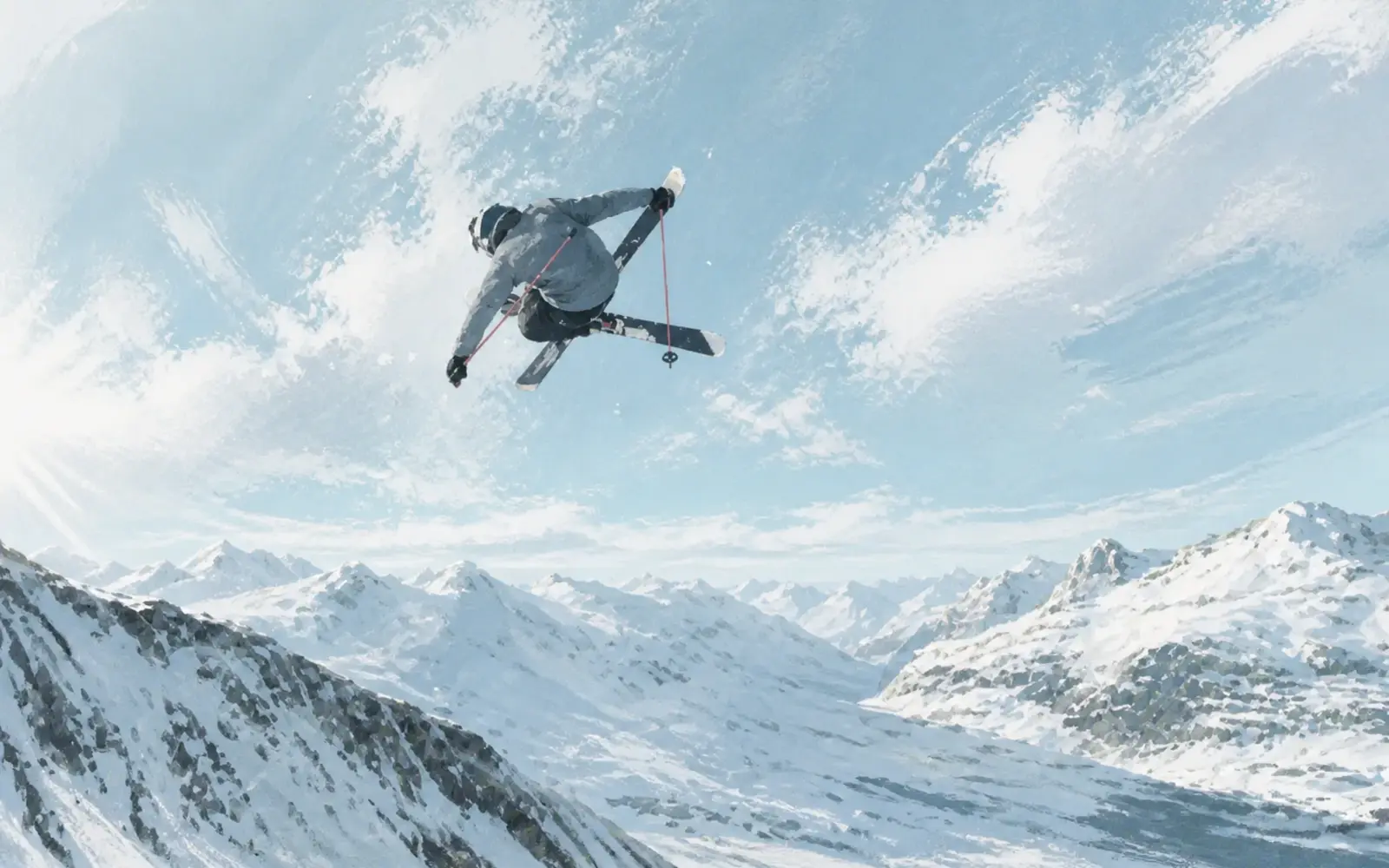 Skier in motion against a cold mountain landscape